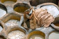 FEZ, MOROCCO Ã¢â¬â APRIL 10, 2016: The incredible historical tannery in Fez, Morocco. Workers painting leather in Morocco, Africa o